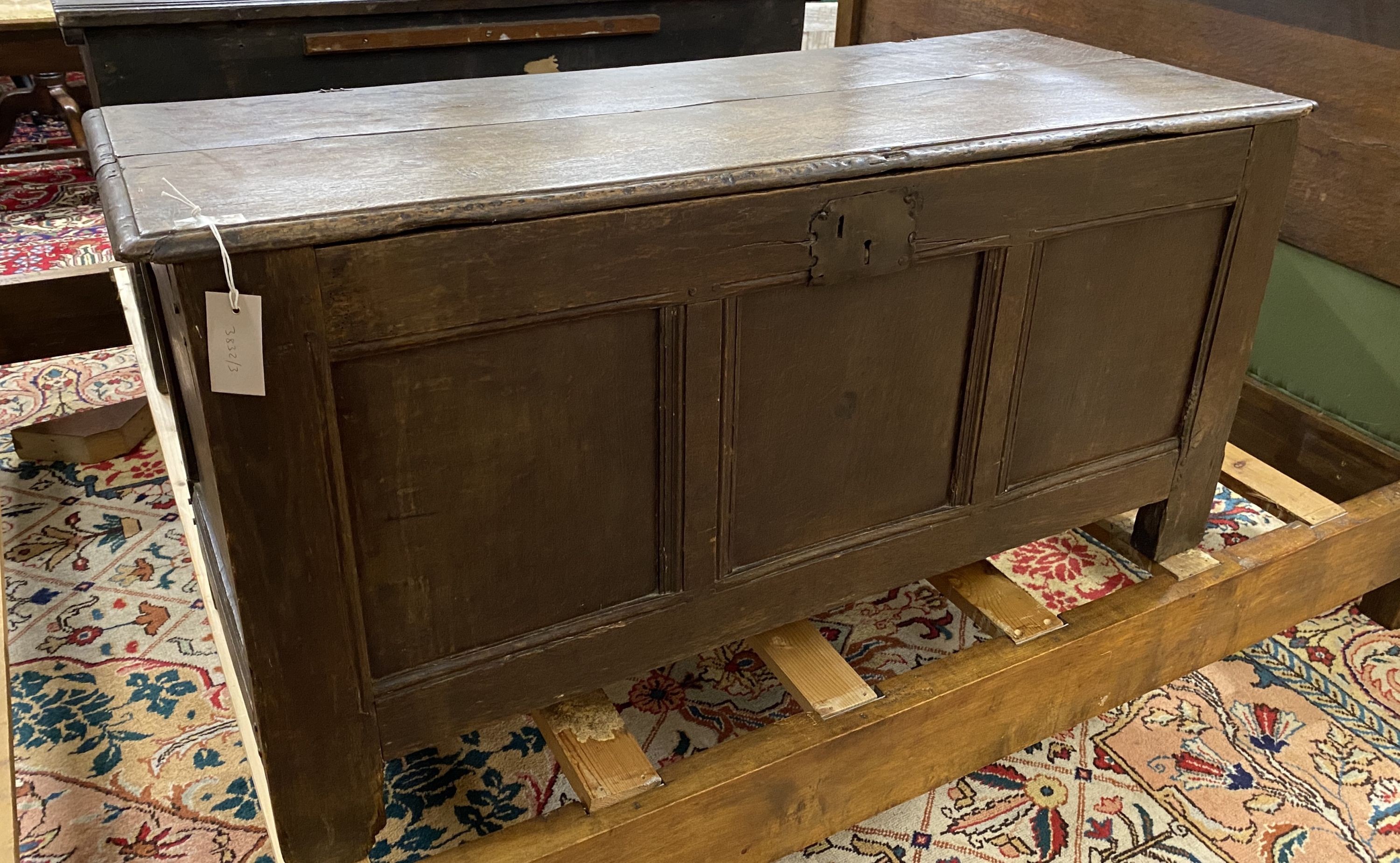 An 18th century panelled oak coffer, length 114cm, depth 47cm, height 56cm